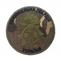 Кокарда НГУ Мультикам